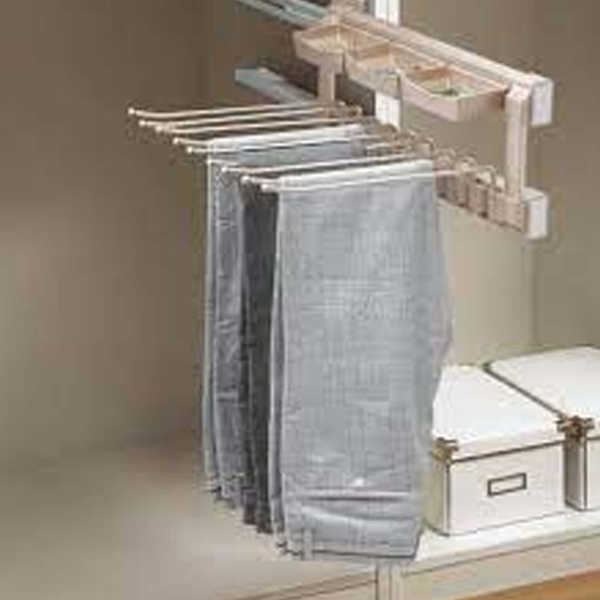 LATERAL MULTIFUNCTIONAL TROUSERS RACK WITH SOFT-CLOSING MECHANISM